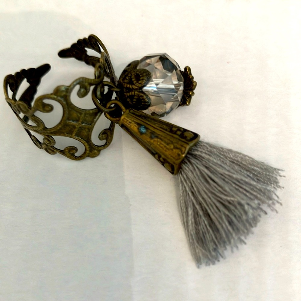 ADJUSTABLE Ring. VERY THIN METAL BRONZE-LOOK RING. Grey Tassel. Clear Babble.